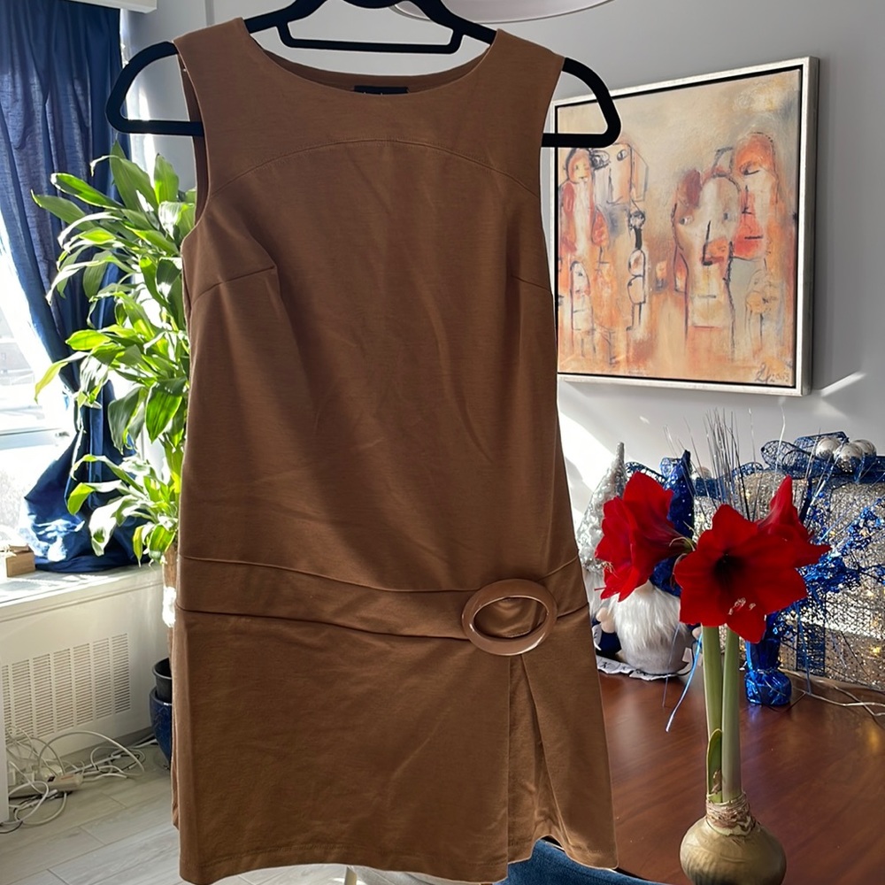 Bebe. Beige flared mini dress with brooch. Size M.